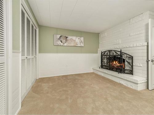 231077 Twp 100A, Rural Lethbridge County, AB - Indoor Photo Showing Other Room With Fireplace