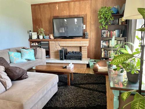 2117 19 Avenue South, Lethbridge, AB - Indoor Photo Showing Living Room With Fireplace