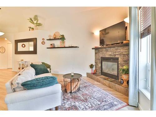 14 Edinburgh Gate West, Lethbridge, AB - Indoor Photo Showing Living Room With Fireplace