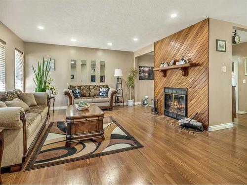 1611 24 Street South, Lethbridge, AB - Indoor Photo Showing Living Room With Fireplace