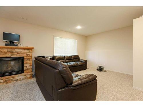 361 Red Crow Boulevard West, Lethbridge, AB - Indoor Photo Showing Living Room With Fireplace