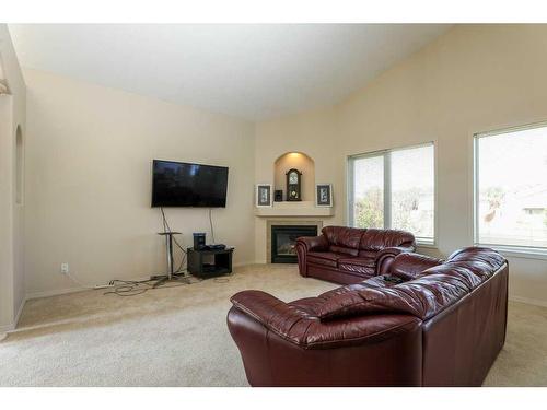 361 Red Crow Boulevard West, Lethbridge, AB - Indoor Photo Showing Living Room With Fireplace