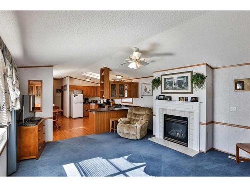 612 Grand Avenue, Carmangay, AB - Indoor Photo Showing Living Room With Fireplace