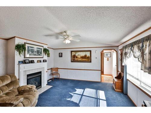 612 Grand Avenue, Carmangay, AB - Indoor Photo Showing Living Room With Fireplace