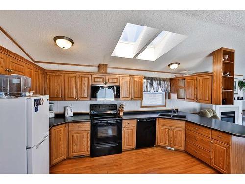 612 Grand Avenue, Carmangay, AB - Indoor Photo Showing Kitchen With Double Sink