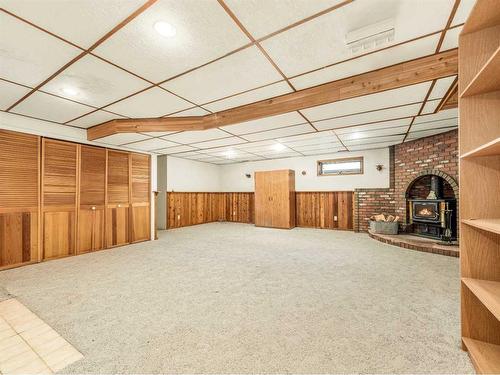 920 Wilderness Avenue, Pincher Creek, AB - Indoor Photo Showing Other Room With Fireplace