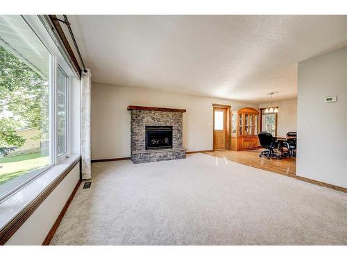 29211 Twp Road 6-0, Rural Pincher Creek No. 9, M.D. Of, AB - Indoor Photo Showing Living Room With Fireplace