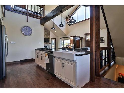 152 School Avenue, Mountain View, AB - Indoor Photo Showing Living Room With Fireplace