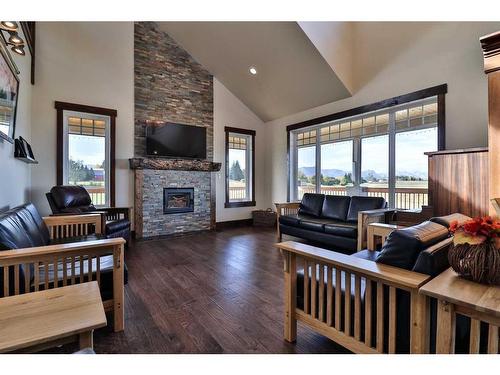 152 School Avenue, Mountain View, AB - Indoor Photo Showing Living Room With Fireplace