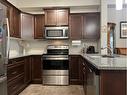 205-173 Fairmont Boulevard South, Lethbridge, AB  - Indoor Photo Showing Kitchen With Double Sink 