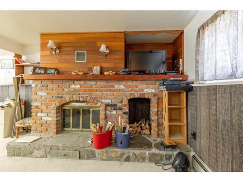 1307 24 Avenue, Coaldale, AB - Indoor With Fireplace