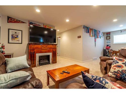 40 Northlander Way West, Lethbridge, AB - Indoor Photo Showing Living Room With Fireplace