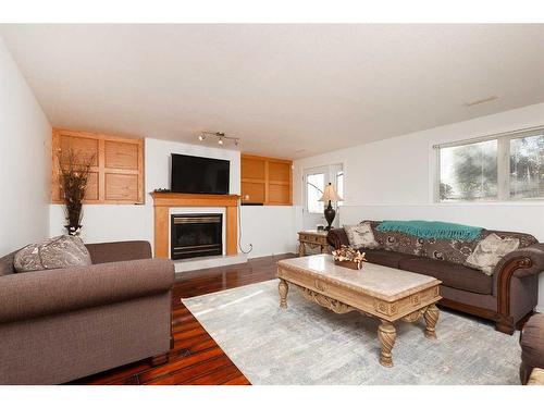 224 Heritage Boulevard West, Lethbridge, AB - Indoor Photo Showing Living Room With Fireplace