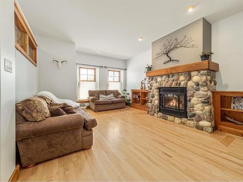 570 27 Street, Fort Macleod, AB - Indoor Photo Showing Living Room With Fireplace