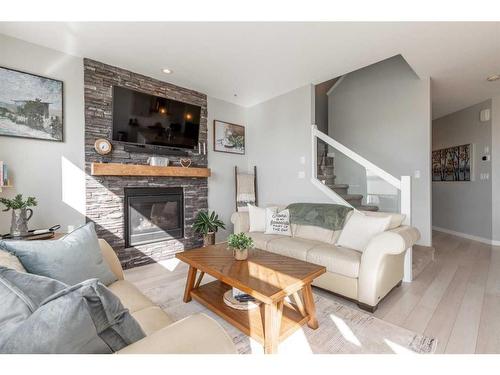 94 Blackwolf Bay North, Lethbridge, AB - Indoor Photo Showing Living Room With Fireplace