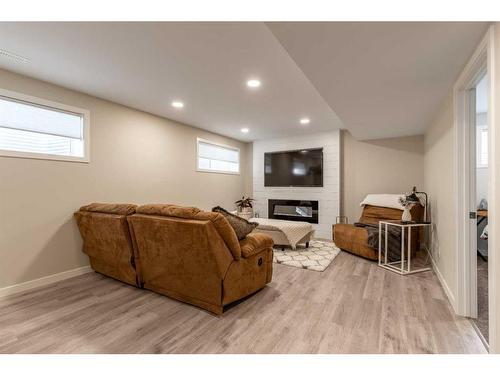 94 Blackwolf Bay North, Lethbridge, AB - Indoor Photo Showing Other Room With Fireplace