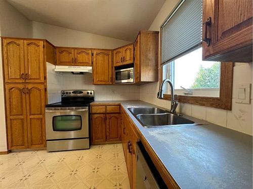 4810 58 Avenue, Taber, AB - Indoor Photo Showing Kitchen With Double Sink