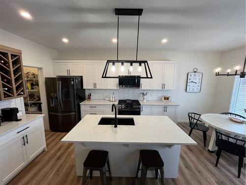 476 Chinook Gate Square Sw, Airdrie, AB - Indoor Photo Showing Kitchen With Double Sink