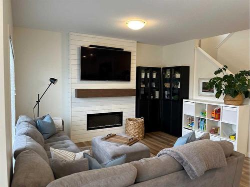 476 Chinook Gate Square Sw, Airdrie, AB - Indoor Photo Showing Living Room With Fireplace