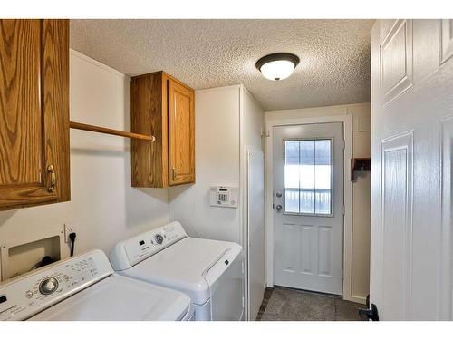 209 4 Avenue North, Champion, AB - Indoor Photo Showing Laundry Room