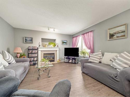 27 Canyon Court West, Lethbridge, AB - Indoor Photo Showing Living Room With Fireplace