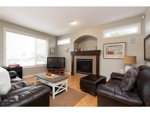 10 Squamish Bay West, Lethbridge, AB - Indoor Photo Showing Living Room With Fireplace