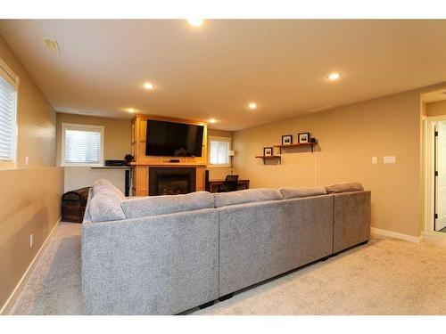 4610 7 Street, Coalhurst, AB - Indoor Photo Showing Living Room With Fireplace