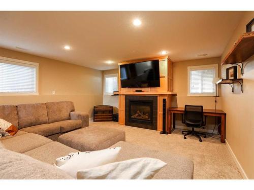 4610 7 Street, Coalhurst, AB - Indoor Photo Showing Living Room With Fireplace