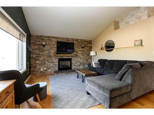 4610 7 Street, Coalhurst, AB - Indoor Photo Showing Living Room With Fireplace