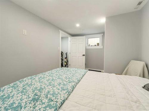 612 Mcdougall Street, Pincher Creek, AB - Indoor Photo Showing Bedroom