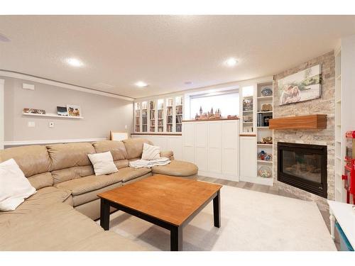 100 Blackfoot Circle West, Lethbridge, AB - Indoor Photo Showing Living Room With Fireplace