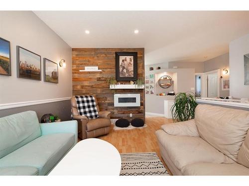 100 Blackfoot Circle West, Lethbridge, AB - Indoor Photo Showing Living Room With Fireplace