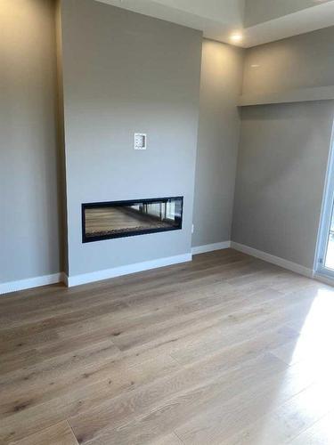 12-102 Scenic Drive North, Lethbridge, AB - Indoor With Fireplace