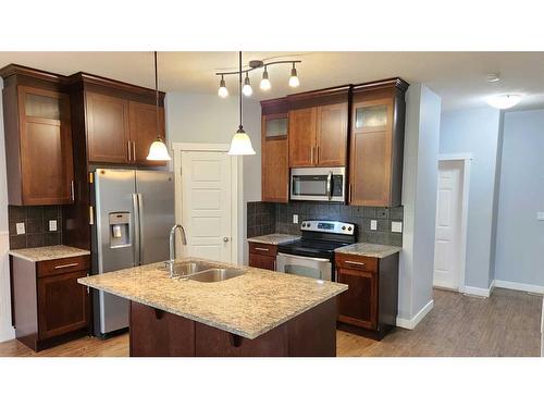 2236 18 Avenue, Coaldale, AB - Indoor Photo Showing Kitchen With Stainless Steel Kitchen With Double Sink With Upgraded Kitchen