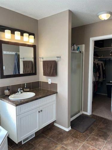 242W 100S, Raymond, AB - Indoor Photo Showing Bathroom