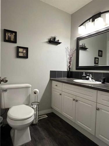 242W 100S, Raymond, AB - Indoor Photo Showing Bathroom