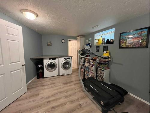 242W 100S, Raymond, AB - Indoor Photo Showing Laundry Room