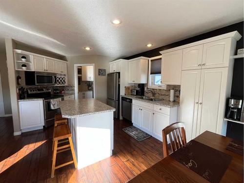 242W 100S, Raymond, AB - Indoor Photo Showing Kitchen With Stainless Steel Kitchen