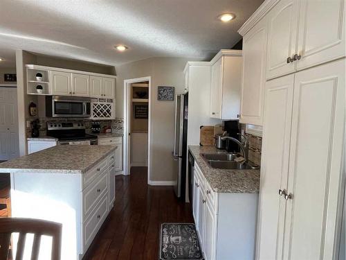 242W 100S, Raymond, AB - Indoor Photo Showing Kitchen With Double Sink