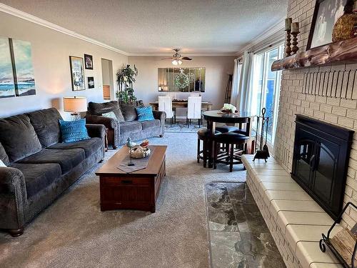 210 4 Street East, Cardston, AB - Indoor Photo Showing Living Room With Fireplace