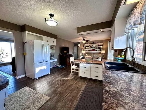 210 4 Street East, Cardston, AB - Indoor Photo Showing Kitchen With Double Sink