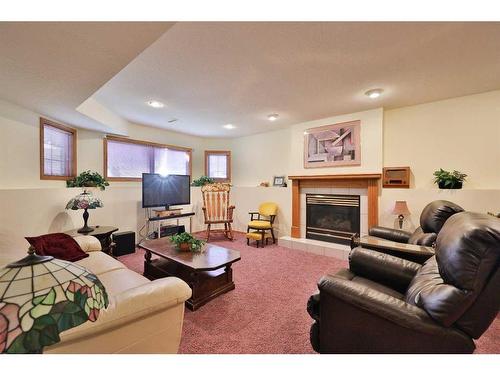 359 Heritage Crescent West, Lethbridge, AB - Indoor Photo Showing Living Room With Fireplace