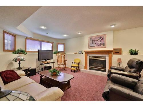 359 Heritage Crescent West, Lethbridge, AB - Indoor Photo Showing Living Room With Fireplace