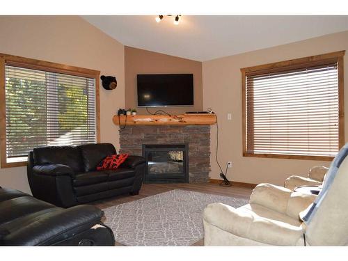 401 Castle Mountain Way, Rural Pincher Creek No. 9, M.D. Of, AB - Indoor Photo Showing Living Room With Fireplace