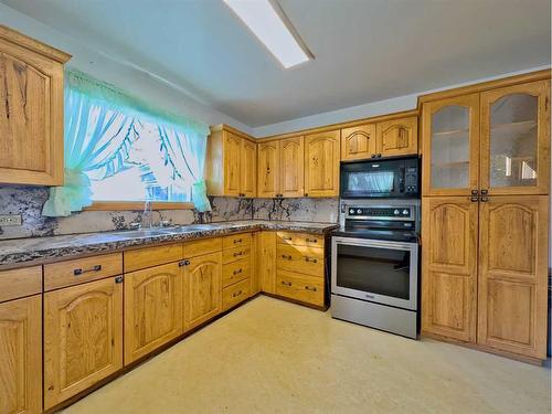 1302 83 Street, Coleman, AB - Indoor Photo Showing Kitchen With Double Sink