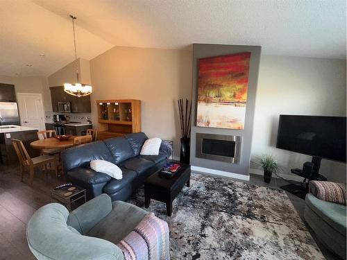 #3-47 Aquitania Circle West, Lethbridge, AB - Indoor Photo Showing Living Room With Fireplace