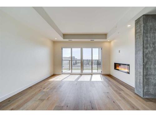 224-102 Scenic Drive North, Lethbridge, AB - Indoor Photo Showing Other Room With Fireplace