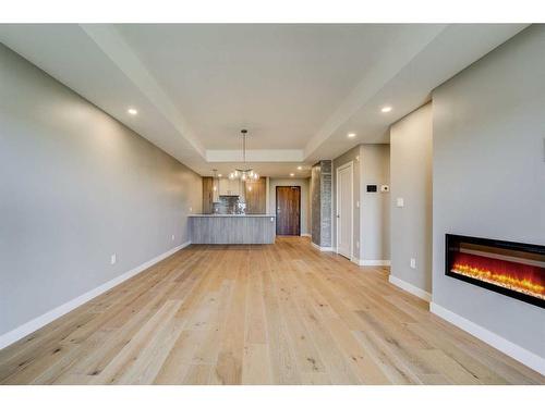 318-102 Scenic Drive North, Lethbridge, AB - Indoor Photo Showing Living Room With Fireplace