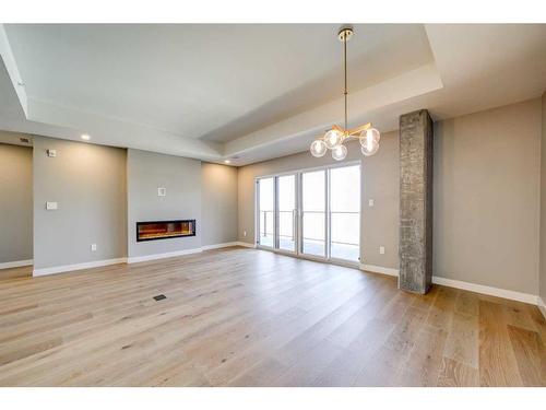 321-102 Scenic Drive North, Lethbridge, AB - Indoor With Fireplace