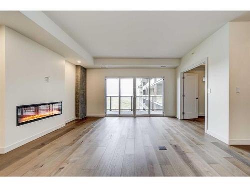 325-102 Scenic Drive North, Lethbridge, AB - Indoor Photo Showing Living Room With Fireplace